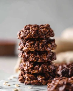 Delicious homemade chocolate oatmeal cookies cooling on a baking rack.