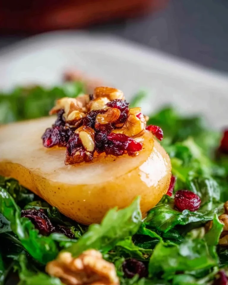 Delicious Pear and Blue Cheese Salad with greens and nuts on a plate
